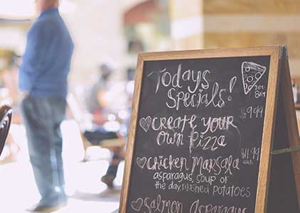 standup chalkboard menu on street